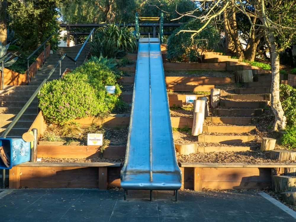 Twin metal hillside slides - bring cardboard