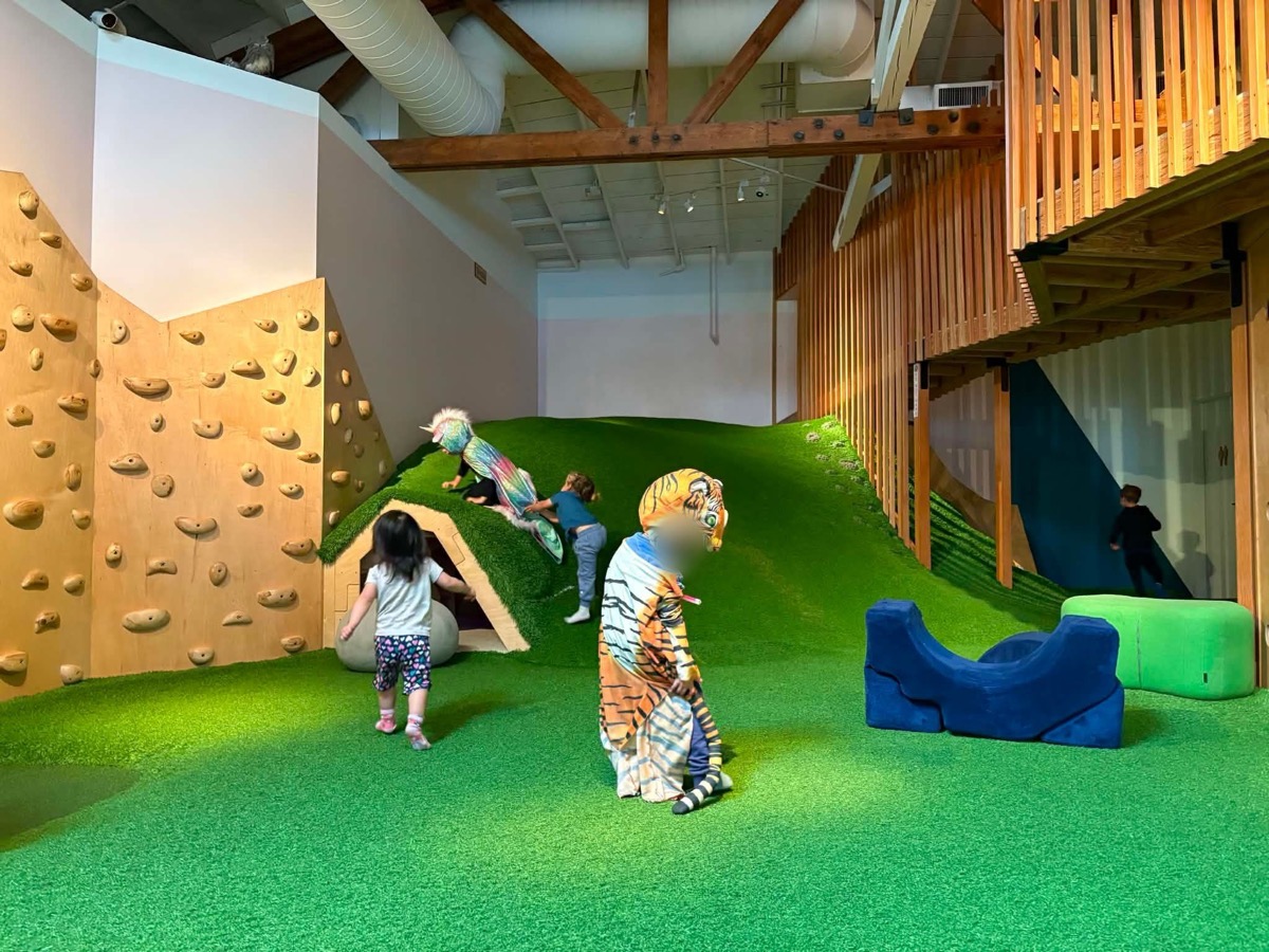 Indoor imaginative-play playground with a cafe