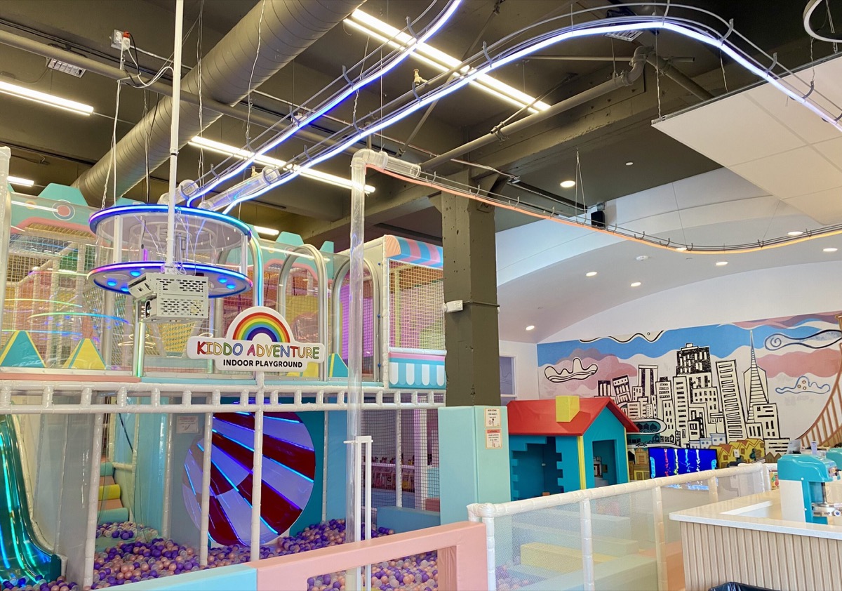 Indoor play center with slides and role-play zones